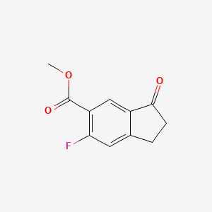 Methyl 6-fluoro-3-oxo-2,3-dihydro-1H-indene-5-carboxylate chemical structure (CAS 1273651-10-7)