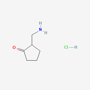 2-(Aminomethyl)cyclopentanone hydrochloride chemical structure (CAS 1360547-45-0)