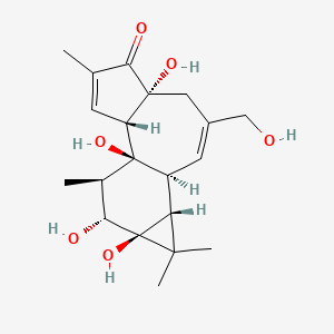 (1aR,1bS,4aR,7aS,7bS,8R,9R,9aS)-4a,7b,9,9a-Tetrahydroxy-3-(hydroxymethyl)-1,1,6,8-tetramethyl-1b,4,4a,7a,7b,8,9,9a-octahydro-1H-cyclopropa[3,4]benzo[1,2-e]azulen-5(1aH)-one chemical structure (CAS 17673-25-5)