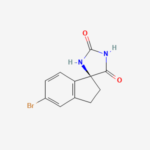 (S)-5'-Bromo-2',3'-dihydrospiro[imidazolidine-4,1'-indene]-2,5-dione chemical structure (CAS 1889290-53-2)