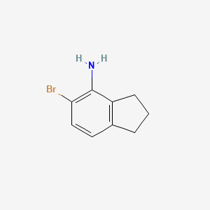 5-Bromo-2,3-dihydro-1H-inden-4-amine chemical structure (CAS 2260959-47-3)