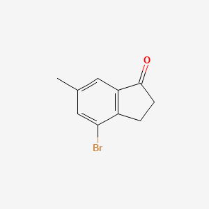 4-Bromo-6-methyl-2,3-dihydro-1H-inden-1-one chemical structure (CAS 876-91-5)